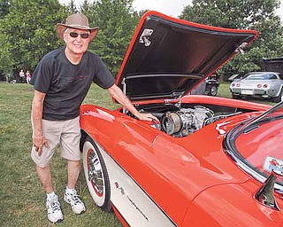 Ed Swaneck stands by his 1957 Corvette at the Mahoning Valley Olde Car Club’s 33rd annual Cars in the Park in Boardman. The Corvette only has 20 miles on its odometer.
