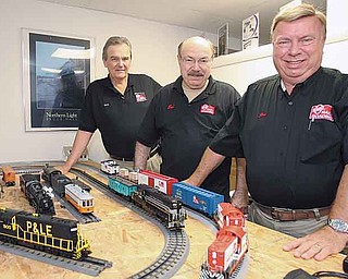 From left, Rich Melvin, publisher, Ed Boyle, ad sales and marketing director and Jim Barrett, vice president and assistant editor, are three of the seven staffers who compile O Gauge Rail-Roading, a seven-time-a-year, 100-page magazine dedicated to electric trains that’s based in Poland.