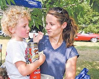 Proceeds from the Cars in the Park show at Boardman Township Park went to the family of Hunter Shaffer, a 4-year-old New Waterford boy with refractory epilepsy, a seizure disorder. Hunter munched on Pringles in the arms of his mother, Dana Shaffer.
