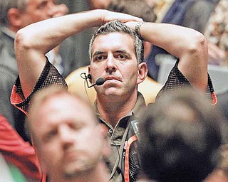 Trader Patrick Garveyreacts after the close of trading in the S&P 500 Futures pit, on the floor of The CME Group Monday, Aug. 8, 2011, in Chicago. Stocks plummeted at the close after anxiety overtook investors on the first trading day since Standard & Poor's downgraded American debt. (AP Photo/M. Spencer Green)