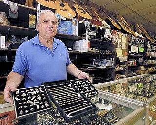 Rick Fine, owner of Sandel’s Loan Inc. & Pawn Shop, 306 W. Federal St., said he doesn’t think the price of an ounce of gold can climb much higher than its current rate. Gold on Tuesday set another record high.