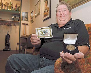 Richard Quinn of Boardman discovered a postcard with an early Ancient Order of Hibernian logo, which is now being used on the back of the AOH’s national commemorative coin to celebrate the organization’s 175th anniversary. Quinn said the postcard design was created by Youngstown Hibernian Cornelius J. Cronin in the late 1800s.