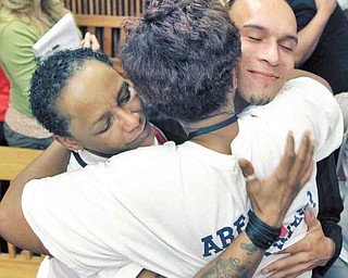 Family, friends and relatives of victims hug after the jury recommended the death penalty for Anthony Sowell Wednesday, August 10, 2011 in Cleveland. Sowell was convicted July 22 of aggravated murder in eleven women's deaths. (AP Photo/The Plain Dealer, Marvin Fong, Pool)