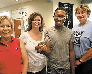 Steven Russ, 17, a senior at East High School, shows off the wings he got from attending Space Camp in Huntsville, Ala. He’s surrounded by East faculty members, from left, Sally Tod Dutton, guidance counselor; Jennifer Walker, English teacher, and Principal Holly Seimetz, whom he calls his angels. The women made Steven’s week at the camp a reality.