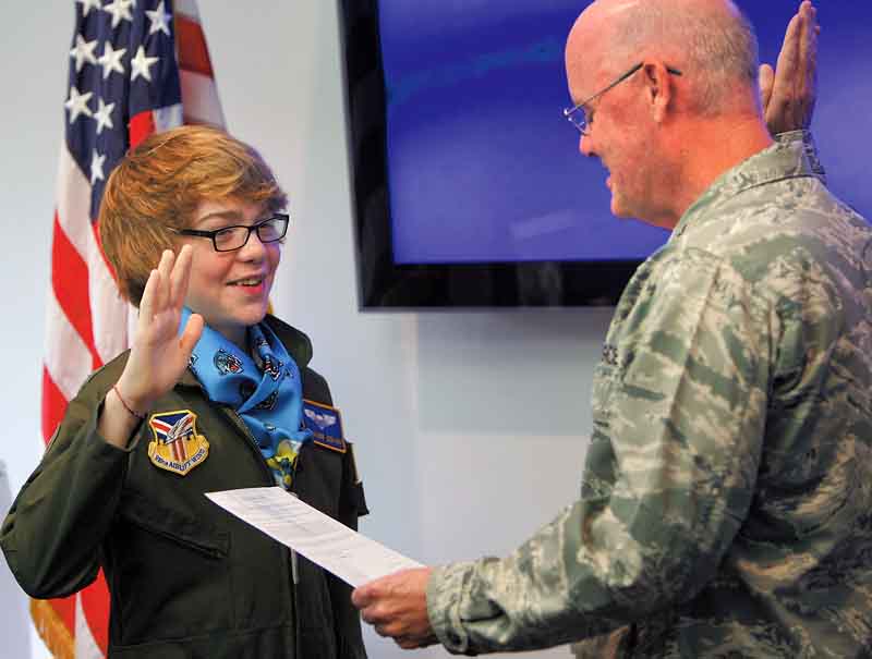 Lt. Col. Dale C. Andrews swore in Connor Covan, 15, of Boardman, as an honorary Air Force Reserve 2nd lieutenant and “Pilot for a Day” at the 910th Airlift Wing on Wednesday.