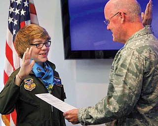 Lt. Col. Dale C. Andrews swore in Connor Covan, 15, of Boardman, as an honorary Air Force Reserve 2nd lieutenant and “Pilot for a Day” at the 910th Airlift Wing on Wednesday.