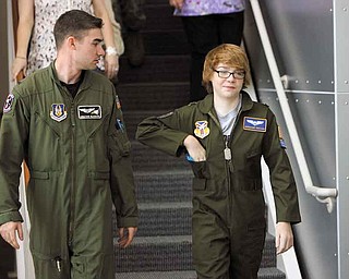 First Lt. Jonathan Blackann escorts honorary Air Force Reserve 2nd Lt.t Connor Covan, 15, of Boardman through the Youngstown Air Reserve Station Wednesday. Covan is the 45th inductee into the program, which began 12 years ago.