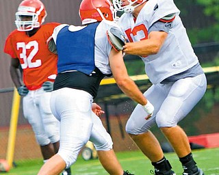 Youngstown State football coach Eric Wolford is looking for vocal leaders, and linebacker John Sasson (53) — the Penguins’ leading tackler last season and one of their most-respected players — may be one of the players to fi ll that role.