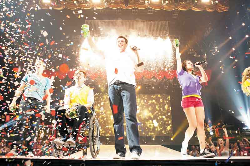 In this image released by 20th Century Fox, from left, Chord Overstreet, Kevin McHale , Cory Monteith  and Lea Michele are shown in a scene from Glee: The 3D Concert Movie." (AP Photo/20th Century Fox)