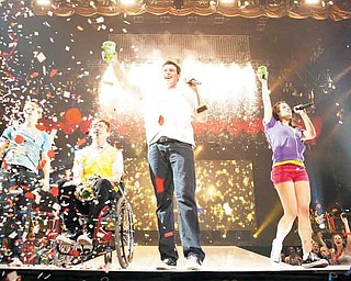 In this image released by 20th Century Fox, from left, Chord Overstreet, Kevin McHale , Cory Monteith and Lea Michele are shown in a scene from Glee: The 3D Concert Movie." (AP Photo/20th Century Fox)