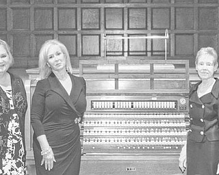 Nick Mays | SPECIAL TO The Vindicator: Committee members for the dual anniversary event for Stambaugh Auditorium and the Youngstown Symphony Orchestra and the dedication of this Skinner pipe organ at the auditorium are, from left, Phil Cannatti, Susan Berny, Jeanne Simeone, Patricia Syak, president and CEO of the Youngstown Symphony Society, and William Conti, president and trustee of Stambaugh.