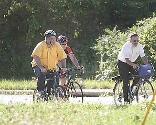 ROBERT K. YOSAY | THE VINDICATOR..Climbing the hill on Hadnet Dr..Ride to work with Franko...Frank Krygowski-- White shirt -- Carl Frost - Orange and Black - Todd Franko in Orange -30-