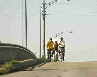 ROBERT K. YOSAY | THE VINDICATOR... Cresting the hill on South Ave Bridge....Ride to work with Franko...Frank Krygowski-- White shirt -- Carl Frost - Orange and Black - Todd Franko in Orange -30-