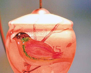 After reopening the Gorant candy store in Austintown last fall, Lori Gavalier and Joyce Gottron, former parks supervisor, decided to include an art gallery display. This hand-painted glass bulb in one of many different types of artwork inside the gallery.