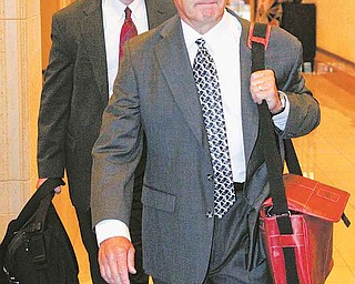 Former Ohio State football coach Jim Tressel arrives for a hearing in Indianapolis, Ind., Friday, Aug. 12, 2011. Tressel had hoped to travel to Indianapolis to be a central figure at the inaugural Big Ten championship game in December. Instead, he's in the city to testify about his role in NCAA violations which have shaken the foundation of Ohio State's powerhouse football program and cost him his job. (AP Photo/Michael Conroy)
