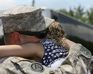 JESSICA M. KANALAS | THE VINDICATOR..Sgt. Michael Burke of Boardman greets his daughter, Maddisen, 5, upon arriving home from a year-long tour of service in Kuwait. .. -30-