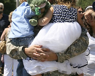 JESSICA M. KANALAS | THE VINDICATOR..Sgt. Michael Burke of Boardman holds his two children, Landon, 4, and Maddisen, 5, after returning home from a year-long tour in Kuwait. .. -30-