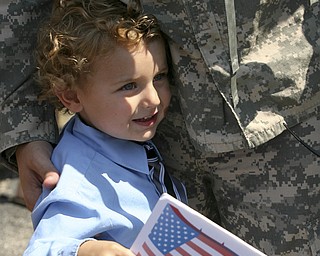 JESSICA M. KANALAS | THE VINDICATOR..Landon Burke, 4, clings to his father, Sgt. Michael Burke from the moment he stepped off the buses to the moment the family left.... -30-