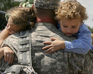 JESSICA M. KANALAS | THE VINDICATOR..Sgt. Michael Burke of Boardman holds his two children, Maddisen, 5, and Landon, 4, after returning home from a year-long tour in Kuwait. .... -30-