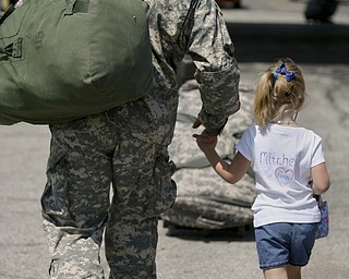 JESSICA M. KANALAS | THE VINDICATOR..Sgt. Roy Mitchell takes the hand of his daughter, Brittany, 5, as he walks to his car with his family. "C'mon girls," he said as he grabbed the hand of one of his three children. "Let's go home."... -30-