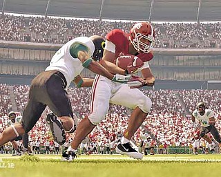 In this screen grab image provided by EA Sports, an Oregon Ducks defender brings down an Alabama player in the video game "NCAA Football 12." (AP Photo/EA Sports)