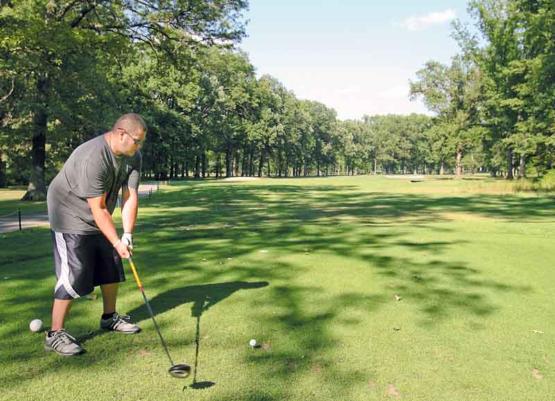 JESSICA M. KANALAS | THE VINDICATOR..CJ Rach, 25, of Youngstown tees off at the 18th hole at the Mill Creek Golf Course in Boardman. Construction is about to start on the hole, moving it and allowing for an expanded driving range to be built. . .-30-