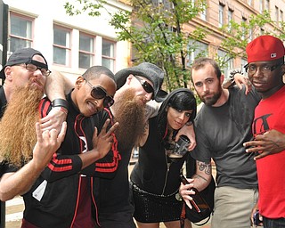 Unlikely friends: Members of Brooklyn's Demolitia and Youngstown's Da Kreek befriend one another during VexFest 8 in downtown Youngstown on Sunday, August 14, 2011.