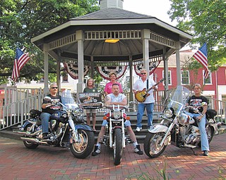 SPECIAL TO THE VINDICATOR | Benefit for humane society:
The Paws-R-Riding-On-It Poker FUNDrun will take place Saturday to benefit the Humane Society of Columbiana County. Entry fee is $15 per couple or $10 for single riders. Registration begins at 10 a.m. at the Steel Trolley Diner in Lisbon and ends with all bikes out at noon. Stops include the Stagecoach Inn in North Georgetown, BB Rooners in Salem and the Original Roadhouse in East Palestine with a return to Guilford Lake Grille in Lisbon. Featured will be guitarist Dave Morgan, boccie, a basket auction, event T-shirts, pull tabs and Best Poker Hand Draw. The event’s main sponsor is Carole’s Daycare of Wellsville. Pictured are, from left, Glenn Taylor of Paws; Jan Palmer, HSCC Humane Agent; Jenny Pike, HSCC president; James Blaschak, sponsor; Dave Morgan; and Marsha McGinnis of Paws. For more information, call Marsha McGinnis at 330-708-0053 or Glenn Taylor at 330-708-1084.