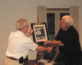 Donlin receives AOH award: Pat Donlin Sr. of Warren, above right, receives the Freedom for All Ireland award from Joe Casey, state president of the Ancient Order of Hibernians. The award recognized Donlin for his decades of research and study of the history and current events of Northern Ireland and for continuously providing information to the AOH membership, especially on the ongoing challenges of the Irish people in the six counties still governed by the British Crown. Donlin is a member of the Trumbull County AOH Sean MacBride Division, and long-time chairman of its Freedom for All Ireland committee. The AOH in America is an Irish-Catholic men’s organization founded in New York and marking its 175th anniversary this year. For more information, contact Dan Gisewhite at 330-307-5325.