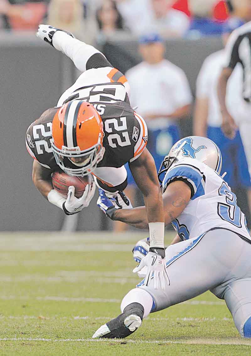 Cleveland Browns' Buster Skrine (22) is upended by Detroit Lions cornerback Paul Pratt on a first-quarter kick return in a preseason NFL football game Friday, Aug. 19, 2011, in Cleveland. (AP Photo/Amy Sancetta)
