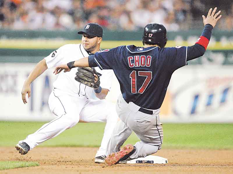 Detroit Tigers shortstop Jhonny Peralta, left, waits for the ball as Cleveland Indians' Shin-Soo Choo, of South Korean, steals second base in the sixth inning of a baseball game, Friday, Aug. 19, 2011, in Detroit. (AP Photo/Duane Burleson)