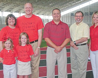 Front from left, Alyson Smith, this year’s Heart Child, and her sister, Emilee, stand in front of their parents, Kevin and Kathy Keaggy Smith. The Smiths will participate in the 2011 Heart Walk Sept. 17 at Youngstown State University. This year’s walk chairman is Wes Prout, center; and emcee is Thomas John Meister of Clear Channel Radio, Youngstown. At right is Theresa Weakley, news anchor for WKBN 27 First News, one of this year’s Walk media sponsors.