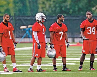 Ohio State running backs Dan Herron (1) Jaamal Berry (4) Jordan Hall (7) and Carlos Hyde (34) during the first day of NCAA college football practice Monday, Aug 8, 2011, in Columbus, Ohio. (AP Photo/Terry Gilliam)