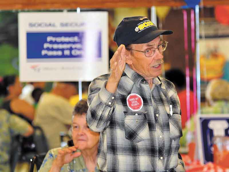 Bill Luoma of Warren makes a point at Tuesday’s rally at SCOPE Senior Center in Warren to celebrate the 76th anniversary of Social Security. Luoma, president of Steelworkers Organization of Active Retirees (SOAR), blames the country’s poor economy and SS financial woes on the loss of jobs overseas.
