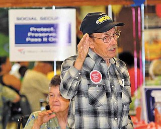 Bill Luoma of Warren makes a point at Tuesday’s rally at SCOPE Senior Center in Warren to celebrate the 76th anniversary of Social Security. Luoma, president of Steelworkers Organization of Active Retirees (SOAR), blames the country’s poor economy and SS financial woes on the loss of jobs overseas.
