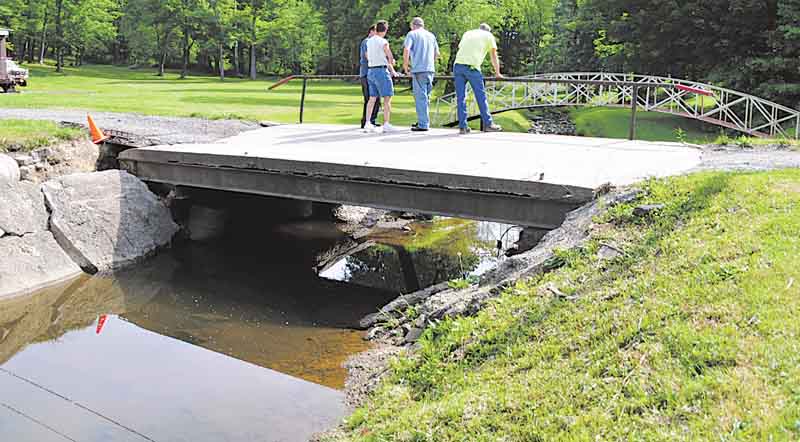This private bridge at the end of the Haynie family’s driveway shows damage after heavy rains caused it to become loose from its foundation. Work to replace the bridge is set to start Monday.