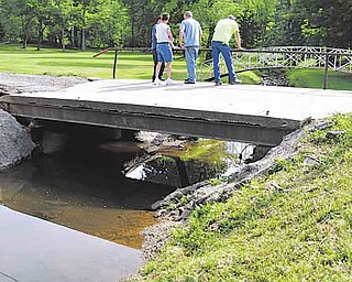 This private bridge at the end of the Haynie family’s driveway shows damage after heavy rains caused it to become loose from its foundation. Work to replace the bridge is set to start Monday.