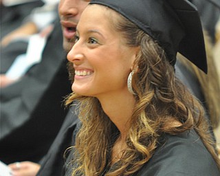 Nicole Sabo laughs at a joke YSU President Cynthia E. Anderson told to the graduates at the the 2011 Summer commencement. Nicole graduated with a major in Food and Nutrition from the College of Health and Human Services....Photo By: Lindsay Y McCall | The Vindicator