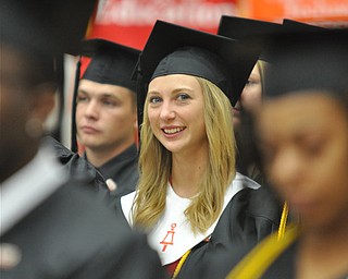 Magna Cum Laude graduate and Honors Program Graduate Kimberly Ann Moore sits patiently as she waits to receive her degree from the College of Science, Technology, Engineering, and Mathematics at the 2011 YSU Summer commencement....Photo By: Lindsay Y McCall | The Vindicator