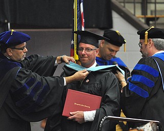 Jason R. Mays earns his Masters of Educational Administration degree at the 2011 YSU summer commencement...Photo By: Lindsay Y McCall | The Vindicator