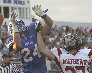 ROBERT K. YOSAY | THE VINDICATOR --..Broken Pass - as #24 Western Reserve Thomas Benyo has a pass broken up by Mathews #27 Ryan Mazey - during first quarter action --- Western Reserve Blue Devils vs Mathews Mustangs at Western Reserve Stadium Thursday night .--30-..(AP Photo/The Vindicator, Robert K. Yosay)