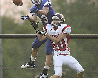 ROBERT K. YOSAY | THE VINDICATOR --..JUMP and TD -- #3 Western Reserves Tim Cooper hauls in a pass for a touchdown as #20 Wyatt Ford tries to defend - Second Quarter action - Western Reserve Blue Devils vs Mathews Mustangs at Western Reserve Stadium Thursday night .--30-..(AP Photo/The Vindicator, Robert K. Yosay)