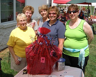 The League of Women Voters of Trumbull County sponsored a basket raffle at Cortland’s “Summer Sizzle” Aug. 5 to raise money to print its “Voter Information Guide.” The guide identifies candidates, upcoming ballot issues and candidates’ views on those issues. Winner of the basket was Marjorie Haidet of Youngstown. Shown above, with the basket, are, from left, Nancy Lorey, league director; Eddie Wolcott, event chairwoman and director; Peggy Boyd, director; Terri Crabbs, past president; and Janice Hardman, president. The league is still accepting donations for the guide. Donations are tax-deductible.