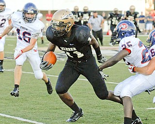 Warren Harding's #11MikQuan Dorsey runs downfield after making a catch over Fitch defenders #25 Justin Fooks #6 Lucas Haupt and #16 Kevin Betts.