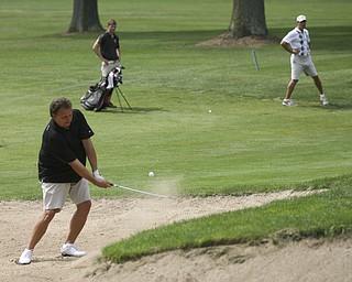 JESSICA M. KANALAS | THE VINDICATOR..Jim Slivanya chips his ball out of a sand pit during day two of the Greatest Golfer Tournament at Youngstown Country Club... -30-