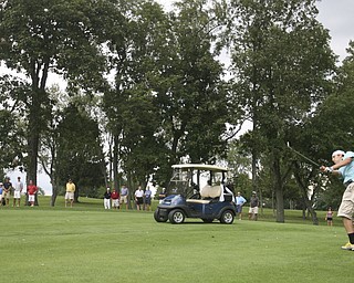 JESSICA M. KANALAS | THE VINDICATOR..Bystanders watch Greg Cook of Mahoning Country Club hit during the final day at the Greatest Golfer of the Valley tournament at The Lake Club.