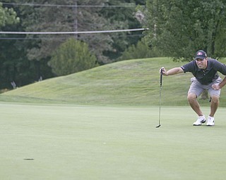 JESSICA M. KANALAS | THE VINDICATOR..Mike Porter of Tippecanoe Country Club and the 2010 Greatest Golfer Champion prepares to putt during the final day at of this years Greatest Golfer of the Valley tournament at The Lake Club.