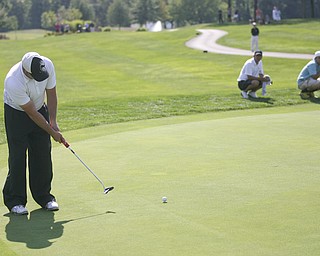 JESSICA M. KANALAS | THE VINDICATOR..Josh Zarlenga of Youngstown Country Club putts during during the final day at the Greatest Golfer of the Valley tournament at The Lake Club as his playing partners, Scott Porter and Greg Cook, watch nearby.