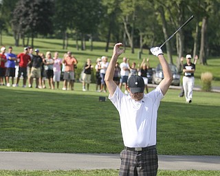 JESSICA M. KANALAS | THE VINDICATOR..Scott Porter of Tippecanoe Country Club shows his excitement, and the crowd in the background joins him, after successfully chipping his ball into the last hole of the final day at the Greatest Golfer of the Valley tournament at The Lake Club.