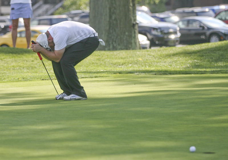 JESSICA M. KANALAS | THE VINDICATOR..Josh Zarlenga of Youngstown Country Club bends down in disappointment after barely missing his putt on the next-to-last hole during the final day at the Greatest Golfer of the Valley tournament at The Lake Club. The miss was a potential winner as he ended the day tied for the lead and lost in a one-hole playoff.
